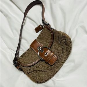 Brown leather and “C” print fabric Coach shoulder bag. In great condition.